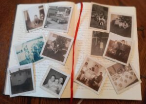 An old journal with sepia and black and white photos